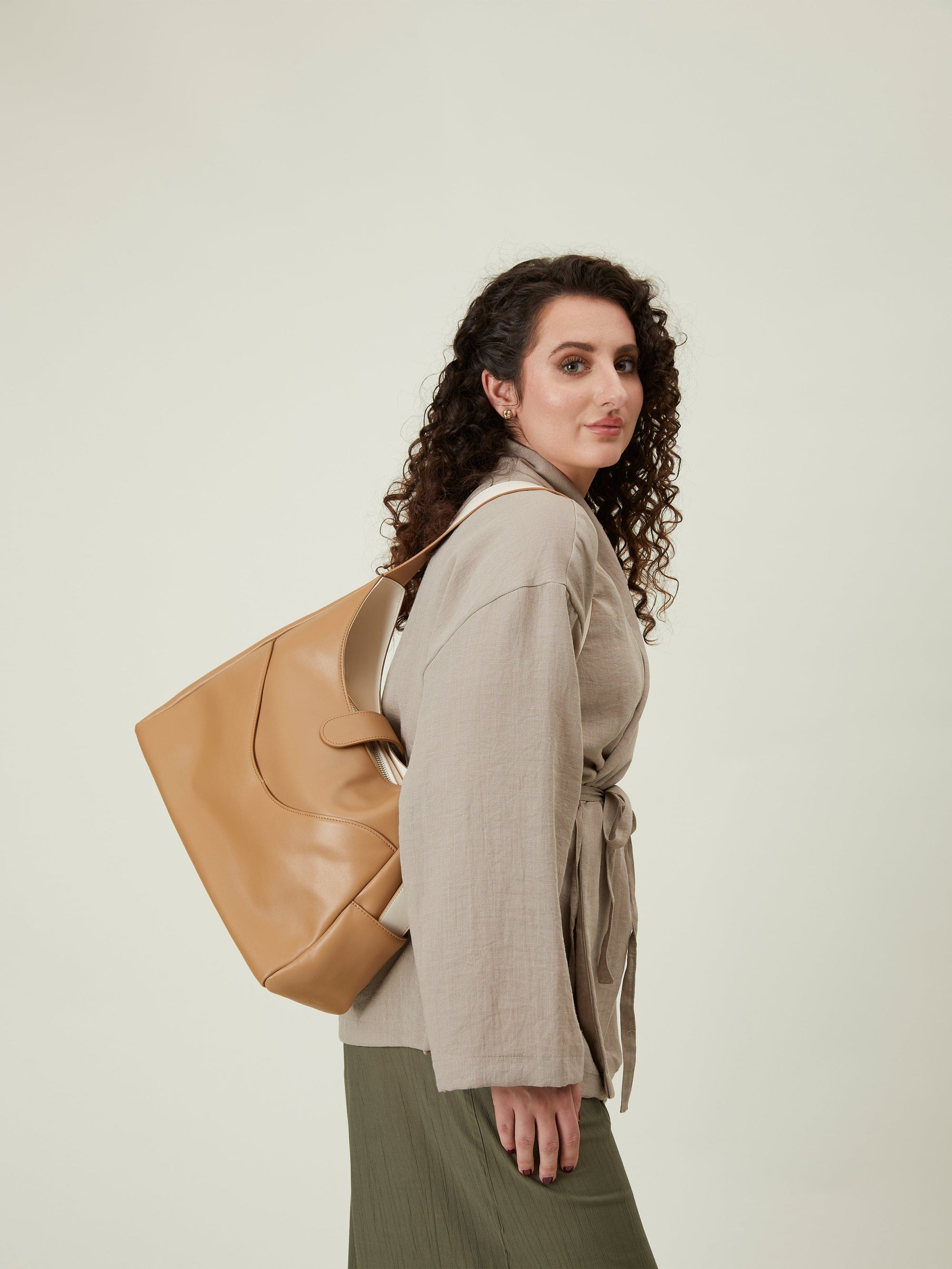 OLEADA Mini Hobo Bag > Women Leather Bag For All Occasions > multiple interior and exterior pockets with a laptop compartment > 13 inch laptop bag > convertible to shoulder bag Reverie Hobo Toffee
