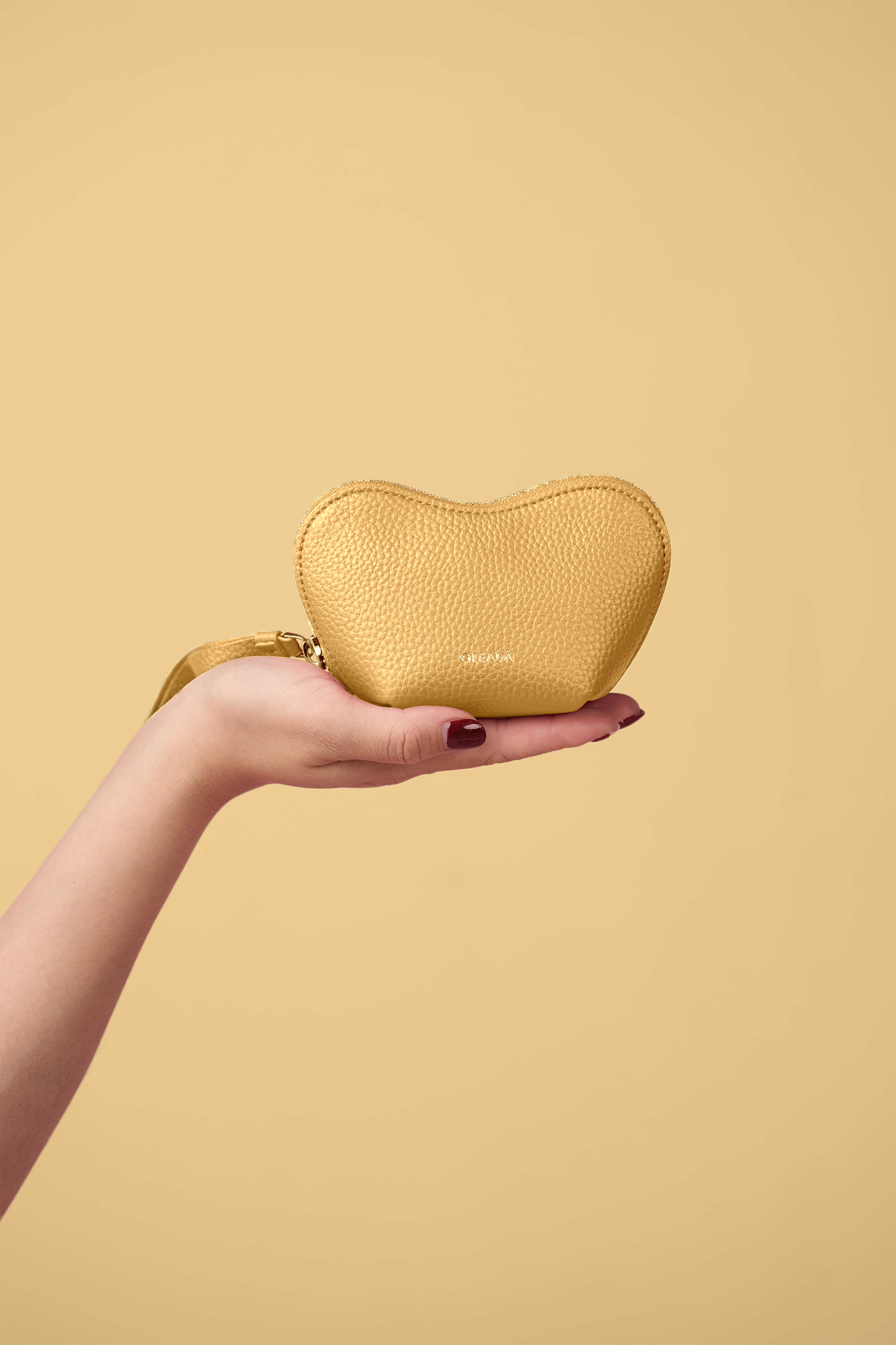 OLEADA NYC Apparel and Accessories > Women > Small Leather Goods > Leather Case Color_Yolk Mini Le Coeur Pouch