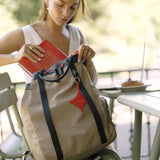 OLEADA NYC convertible travel bags > work-to-travel backpack > commuter bags > water-resistant vegan bags > stylish multi-use backpack Color_Abu Dhabi AnyWear Tennis Backpack